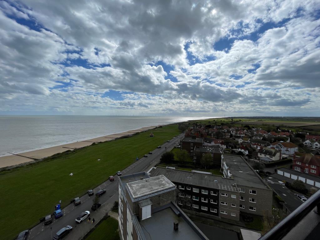 Lot: 137 - THREE-BEDROOM PENTHOUSE FLAT WITH COASTAL VIEWS - View of the coastline from the balcony on 11th floor